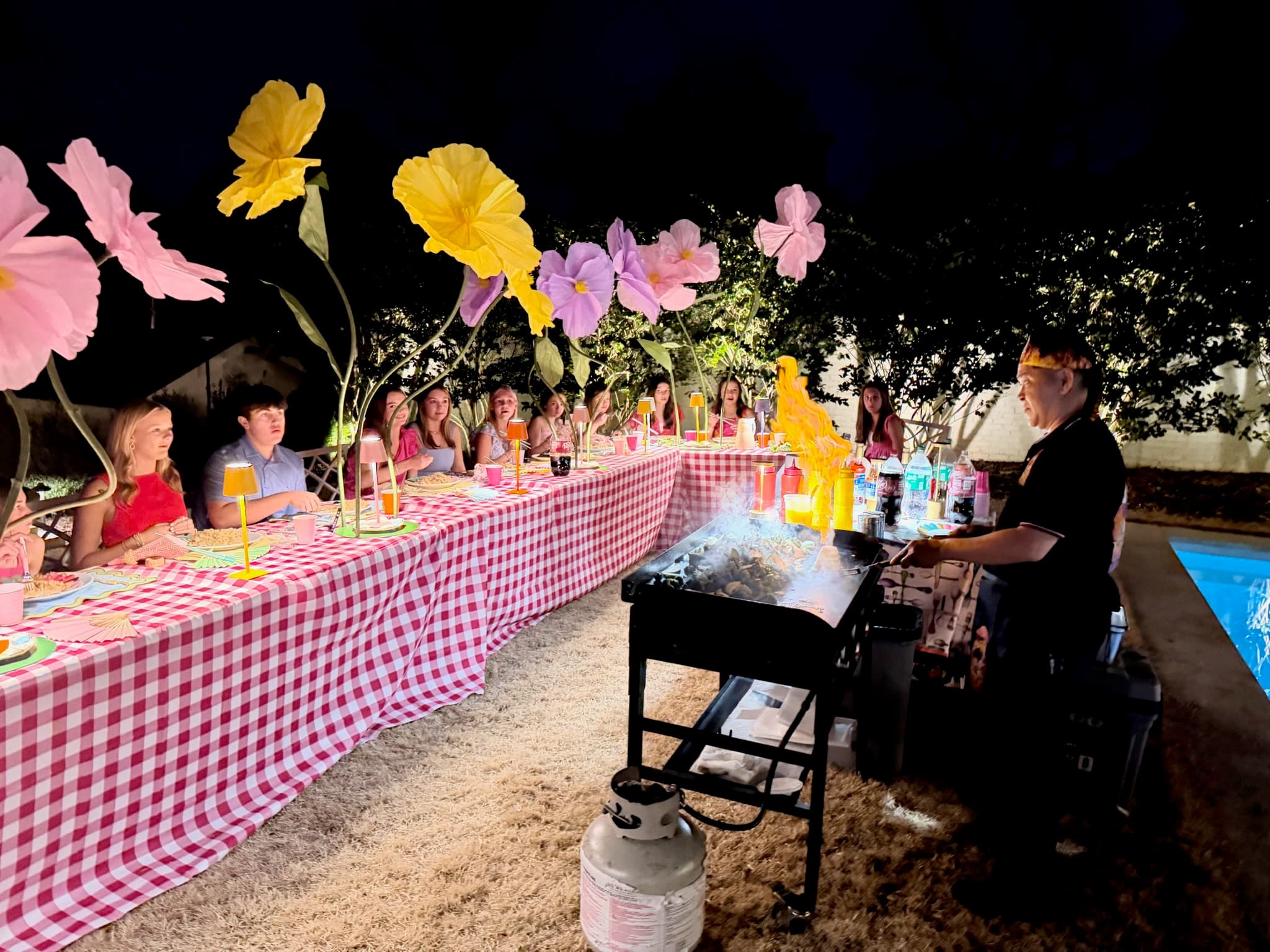 Private hibachi chef cooking at an outdoor dinner party